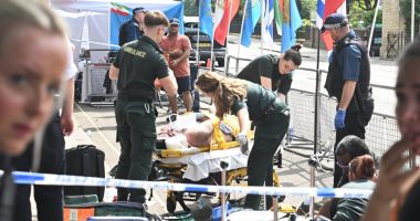 Paramedics attending to a protester injured outside the Iranian embassy.