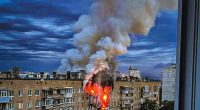 Smoke billowing from a burning building in Kharkiv, Ukraine, after an airstrike.