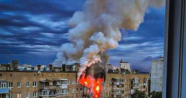Smoke billowing from a burning building in Kharkiv, Ukraine, after an airstrike.