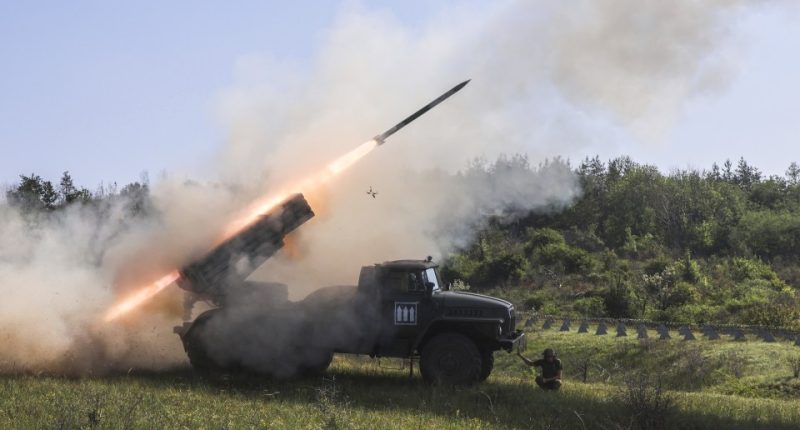 A BM-21 Grad multiple rocket launcher firing a missile.