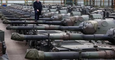 Freddy Versluys, CEO of OIP Land Systems, standing on Leopard 1 tanks.