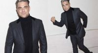 Robbie Williams shows off slimmer figure in grey suit at Q Awards