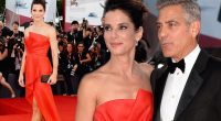 Sandra Bullock stuns in a scarlet strapless dress as she joins George Clooney at the Venice Film Festival premiere of Gravity