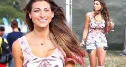 Showing off her wild side: Luisa Zissman parties in tiger print body and tiny denim shorts as she sups bubbly at V Festival
