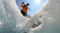 Switzerland's ebbing glaciers show a new, strange phenomenon: Holes reminiscent of Swiss cheese