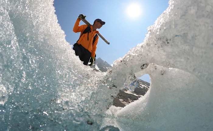 Switzerland's ebbing glaciers show a new, strange phenomenon: Holes reminiscent of Swiss cheese