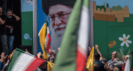 Supreme Leader Ayatollah Ali Khamenei image on the wall during a pro-Iran demonstration