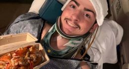 A 19-year-old in a neck brace holds a lobster roll.