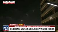 Nighttime video of missile defense systems intercepting a threat over Tel Aviv.