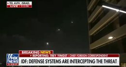 Nighttime video of missile defense systems intercepting a threat over Tel Aviv.