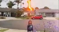 Lightning bolt striking a house near a young girl.