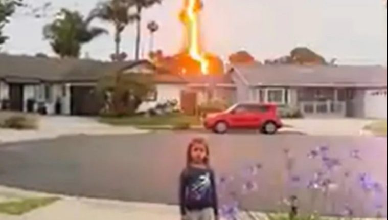 Lightning bolt striking a house near a young girl.