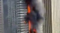 Fire engulfing a Dubai Marina skyscraper; 3,820 evacuated.