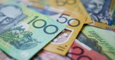 Australian money background showing $100, $50 and $20 notes with a shallow depth of field.