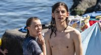 The long-haired ex-public schoolboy who's constantly by Greta's side