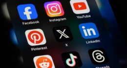 Toronto, Canada - September 24, 2023:  Popular social media apps on an Apple iPhone: Facebook, Instagram, YouTube, Pinterest, X (formerly Twitter), LinkedIn, Reddit, TikTok, and Threads.