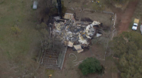 An investigation is underway after a man was assaulted by armed intruders before he was thrown into a car, and his house was set on fire in Yea, Victoria.