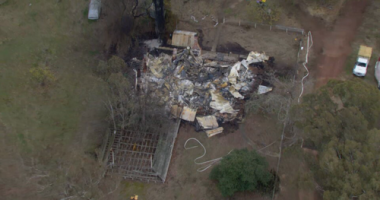 An investigation is underway after a man was assaulted by armed intruders before he was thrown into a car, and his house was set on fire in Yea, Victoria.