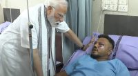 Prime Minister Narendra Modi visiting the sole survivor of the Air India flight 171 crash in a hospital.