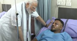 Prime Minister Narendra Modi visiting the sole survivor of the Air India flight 171 crash in a hospital.
