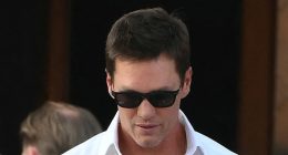 Tom Brady wears velvet slippers with plush bow at Bezos wedding party
