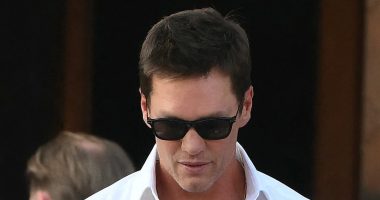 Tom Brady wears velvet slippers with plush bow at Bezos wedding party
