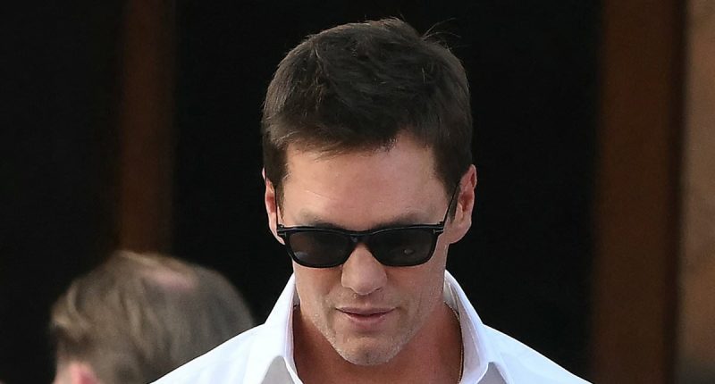 Tom Brady wears velvet slippers with plush bow at Bezos wedding party