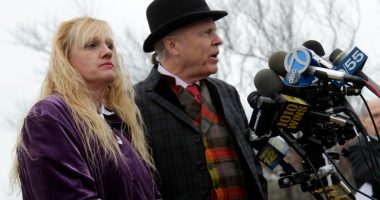Mari Gilbert and her lawyer speaking at a news conference.