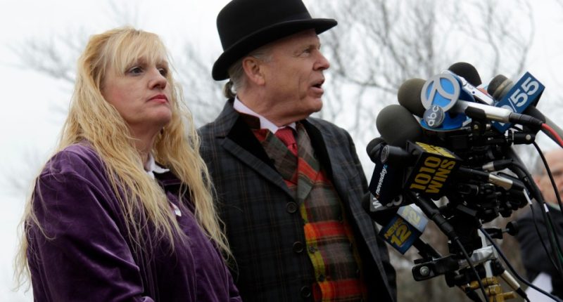 Mari Gilbert and her lawyer speaking at a news conference.