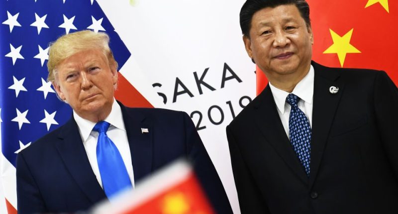 Photo of Donald Trump and Xi Jinping standing together.