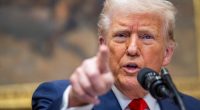 President Donald Trump speaking at a podium.