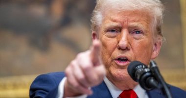 President Donald Trump speaking at a podium.