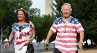 Couple walking near the Washington Monument.