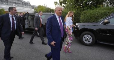 President Donald Trump and first lady Melania Trump walk after greeting guests during the congressional picnic on the South Lawn of the White House, Thursday, June 12, 2025, in Washington. (AP Photo/Alex Brandon)