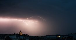 A lighting bolt lights up the sky over Sacre Coeur Basilica in Montmartre during a thunderstorm, northern Paris, on June 25, 2025. (Photo by Julie SEBADELHA / AFP) (Photo by JULIE SEBADELHA/AFP via Getty Images)