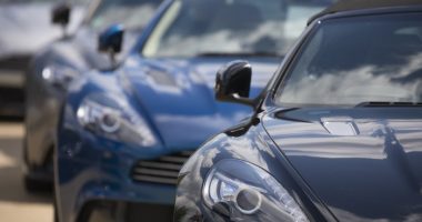Aston Martin Lagondas on display outside a showroom