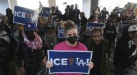Protesters gather at the US Department of Justice Federal Bureau of Prisons after federal immigration authorities conducted an operation in Los Angeles.