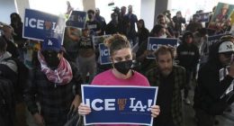 Protesters gather at the US Department of Justice Federal Bureau of Prisons after federal immigration authorities conducted an operation in Los Angeles.
