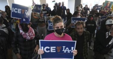 Protesters gather at the US Department of Justice Federal Bureau of Prisons after federal immigration authorities conducted an operation in Los Angeles.