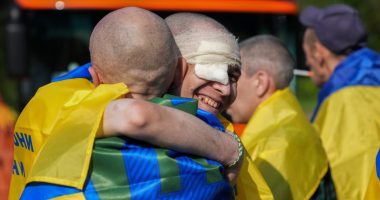 Ukrainian prisoners of war embracing after a prisoner exchange.