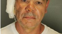 Mugshot of Mohamed Sabry Soliman, showing injuries.