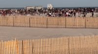 Police helicopter breaking up a beach brawl.