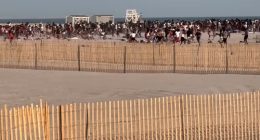 Police helicopter breaking up a beach brawl.