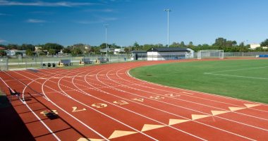 High school running track and football field.