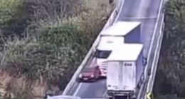 CCTV footage of a car being pushed off an overpass by a lorry.