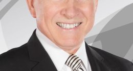 Headshot of Gary England in a suit.