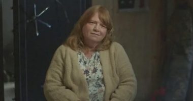 Asa Ellerup sitting in front of a safe.