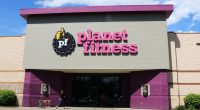 Woman charged after overdose death of man whose body was found in Planet Fitness tanning bed