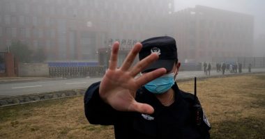 Security guard blocking access to the Wuhan Institute of Virology.