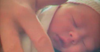 A photo shared by Meghan Markle of her daughter Princess Lilibet as a baby (pictured) bears a striking resemblance to a picture of herself at the same age